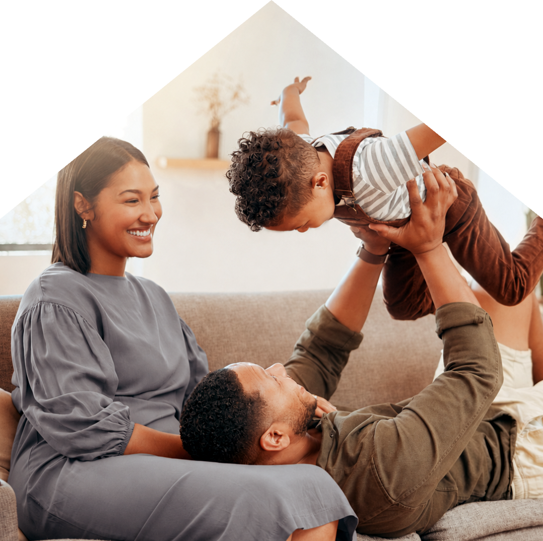 Parents playing with their toddler at home